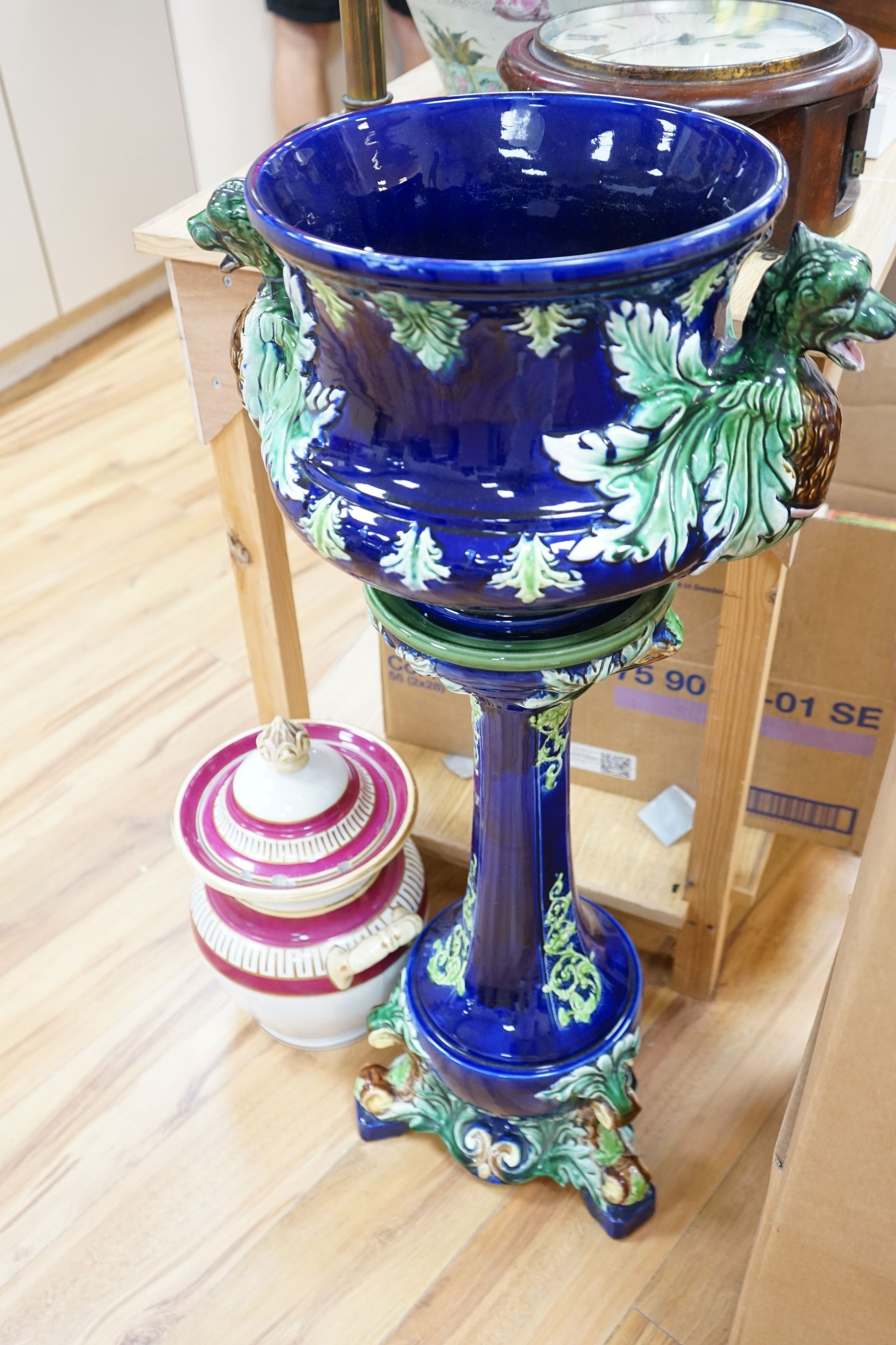 A 19th century majolica jardiniere on pedestal and a two handled jar and cover, jardiniere and stand 99cms high